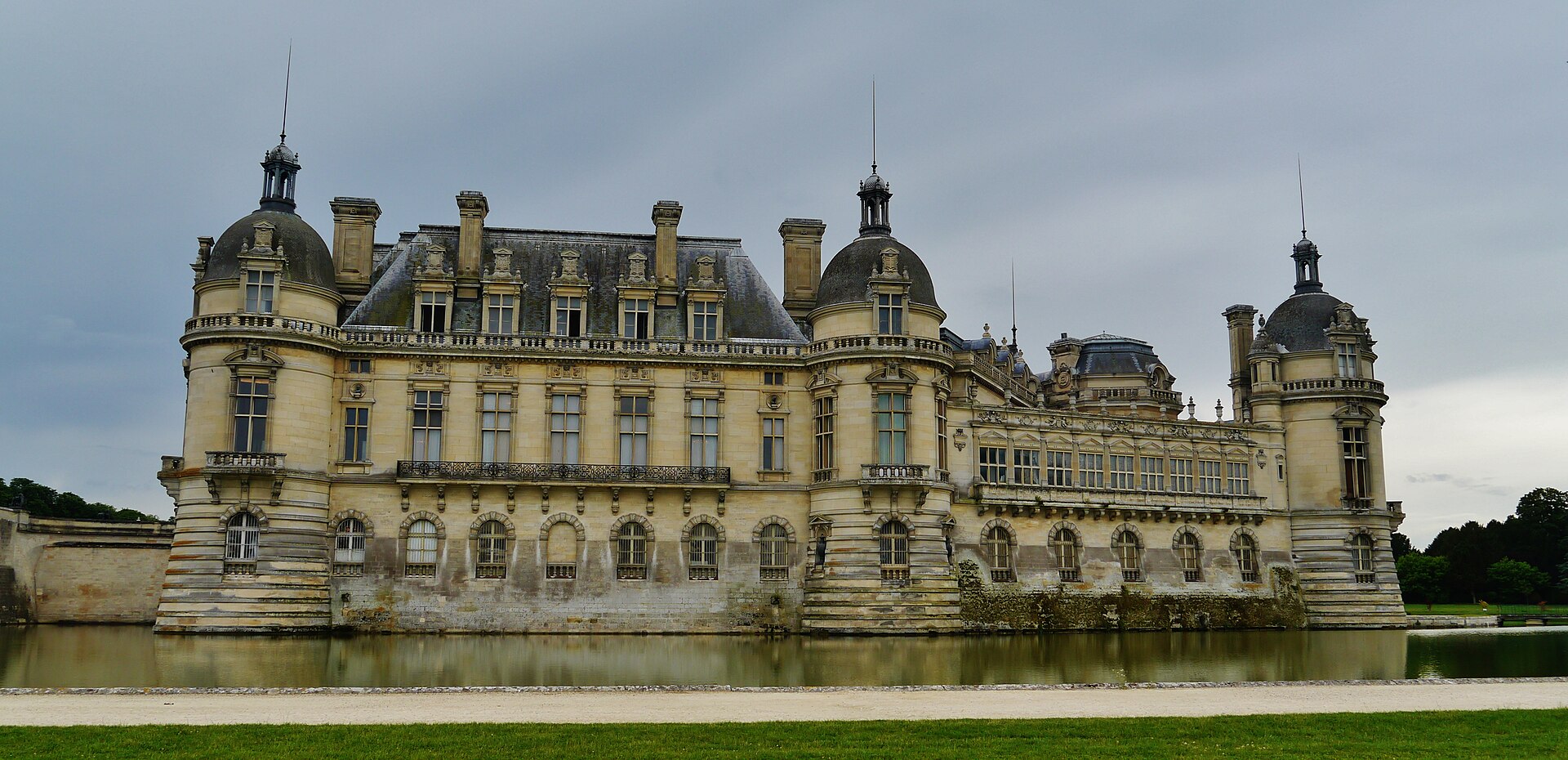 The Château de Chantilly reflected in its moat